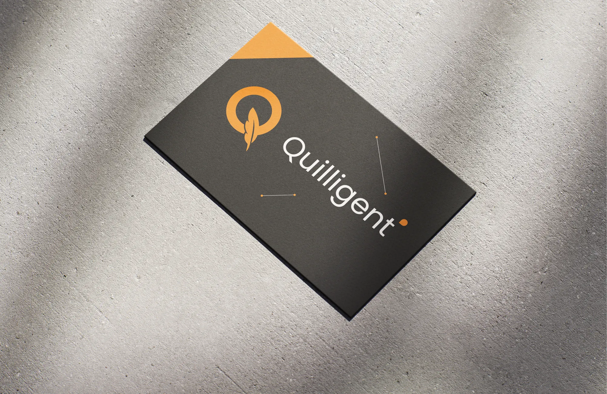 Carbon business card with the orange Q and Quilligent wordmark